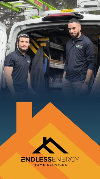 Two Endless Energy technicians standing beside a company van