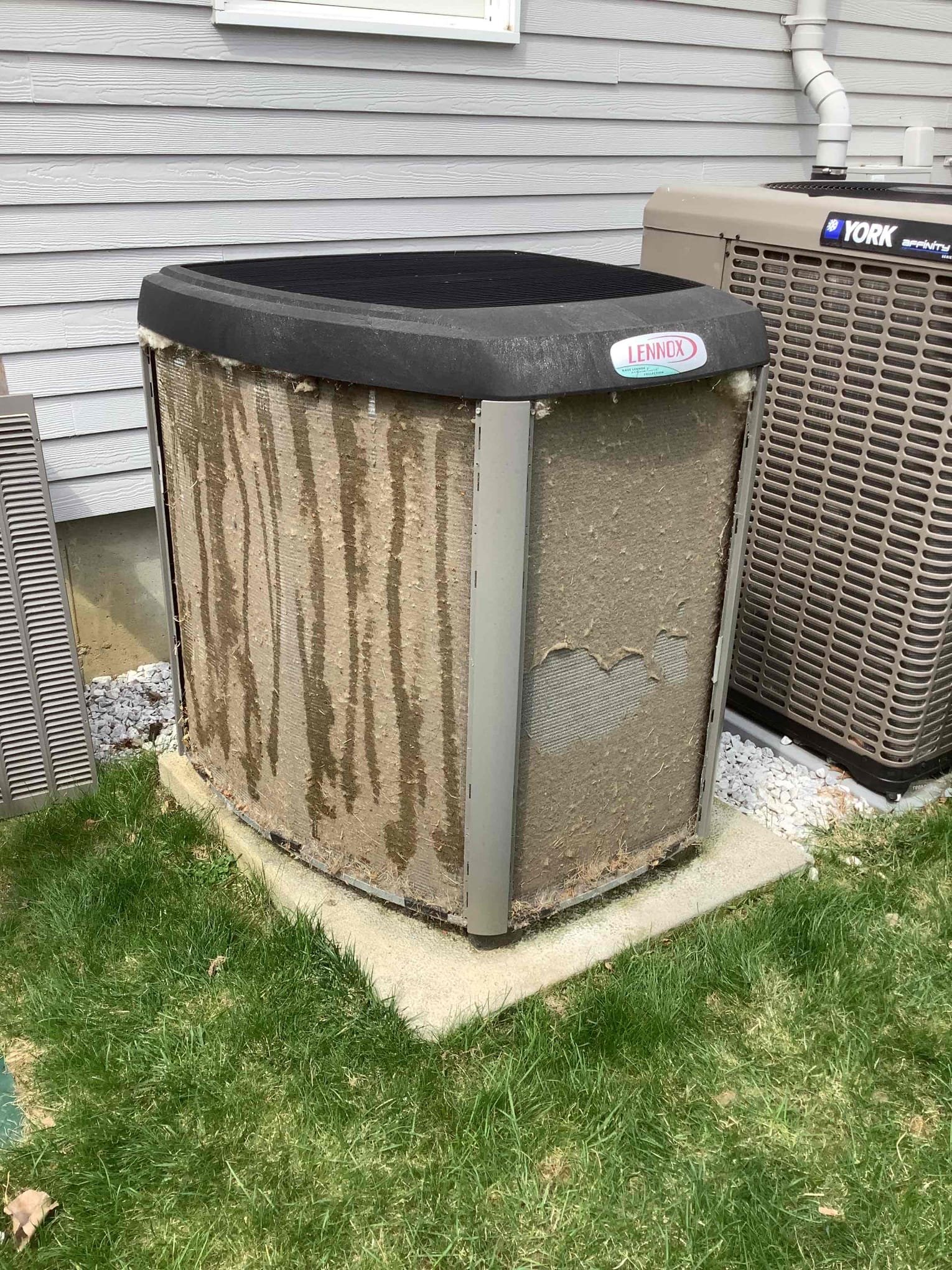 A pollen coated AC unit in Braintree Massachusetts that was given AC maintenance by Endless Energy