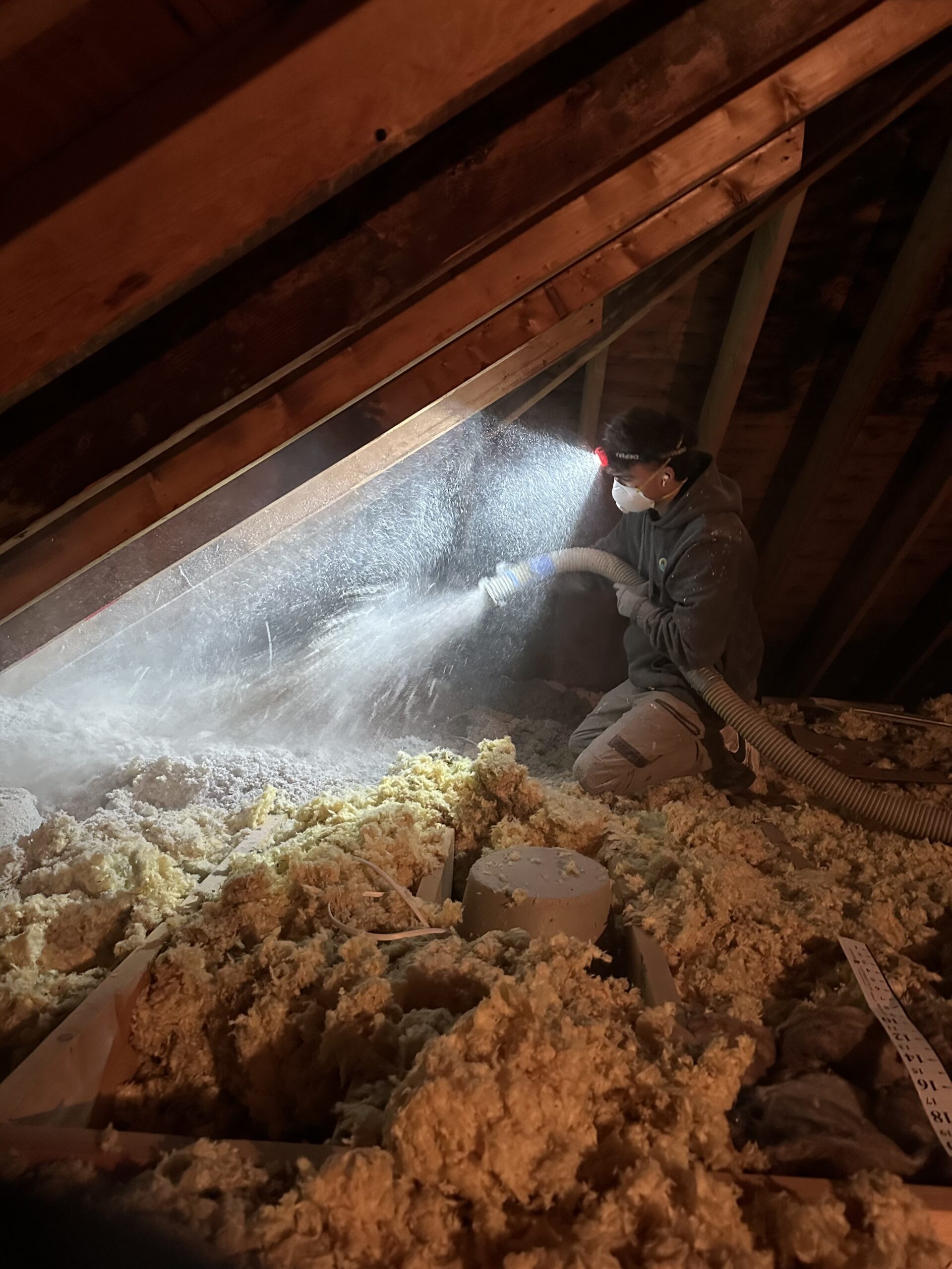 A Mass Save insulation installer from Endless Energy in Newton Massachusetts