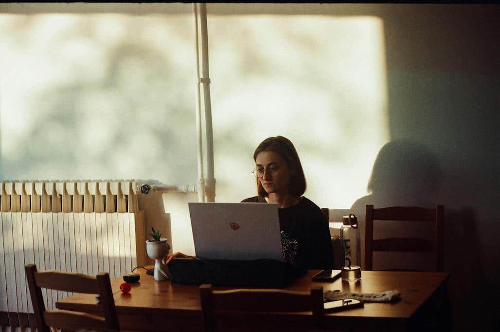 woman enjoys efficient heating after her heat pump tune-up