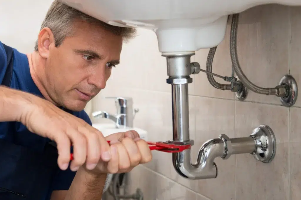 emergency-plumber-fixing-a-pipe