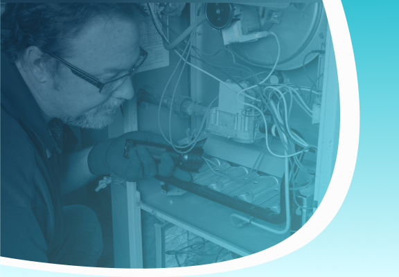 hvac professional repairing furnace