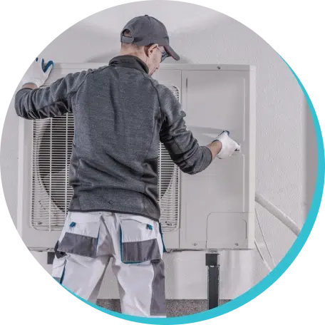 hvac tech installing a heat pump