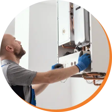 plumber installing tankless water heater system